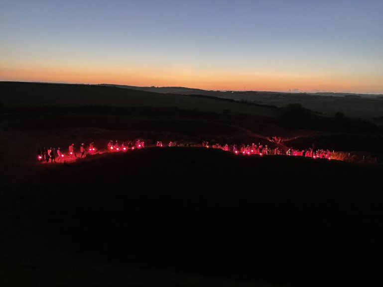Volunteers Illuminate AONB Maiden Castle