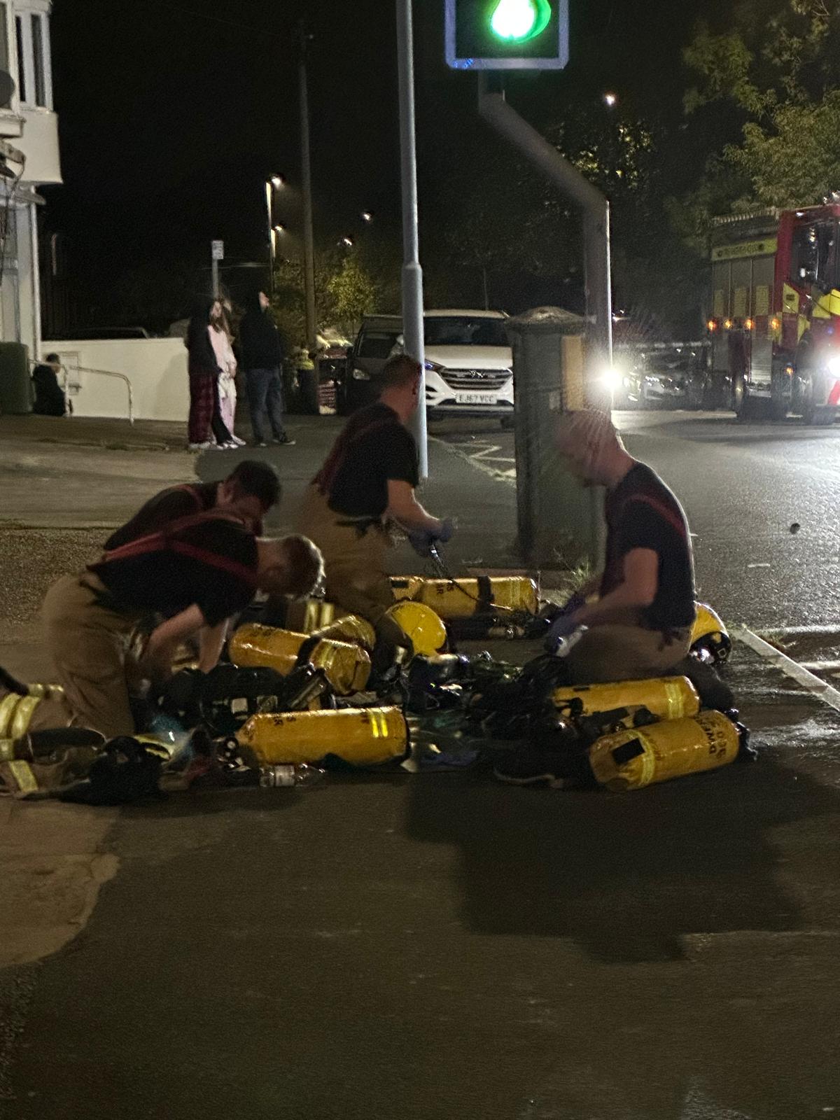 Firefighters preparing kit